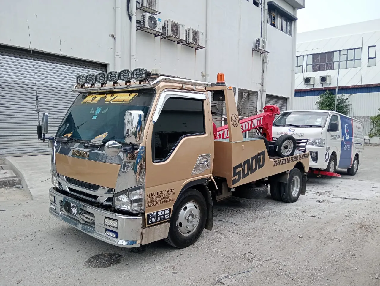 Car carrier transporting a vehicle