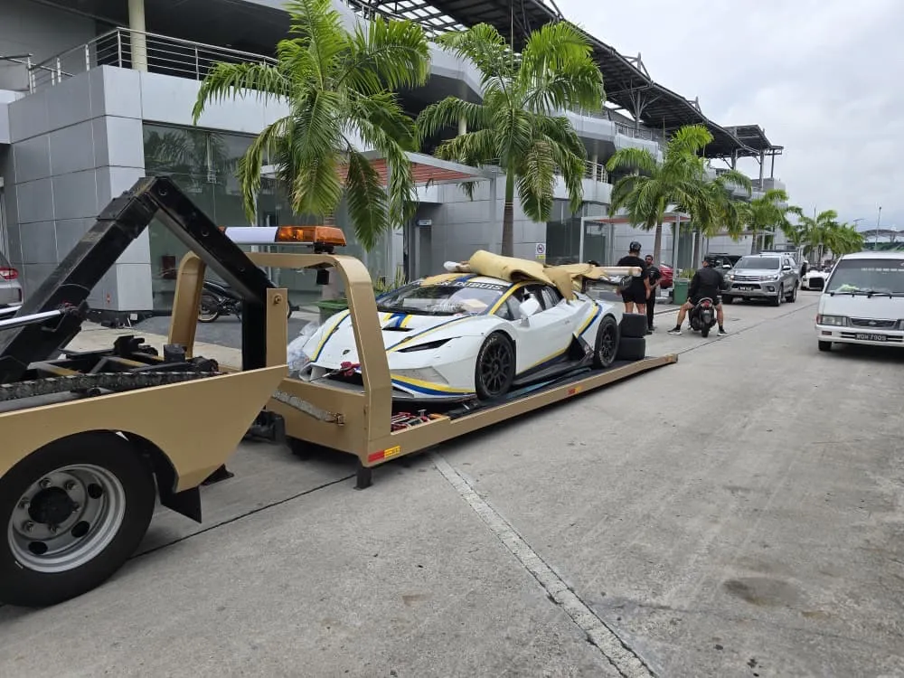 Car carrier transporting a vehicle