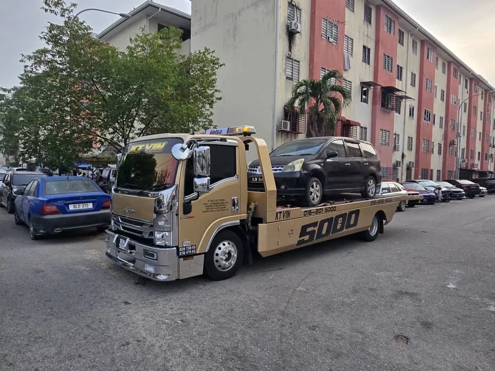 Car carrier transporting a vehicle
