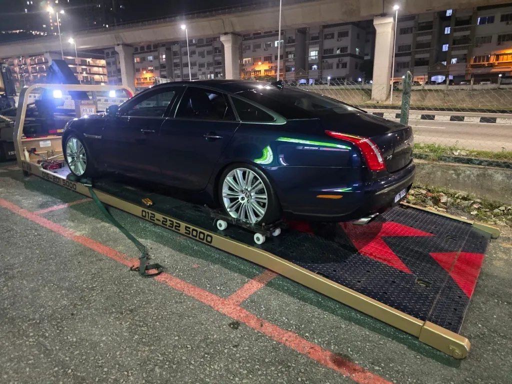 Car carrier transporting a vehicle