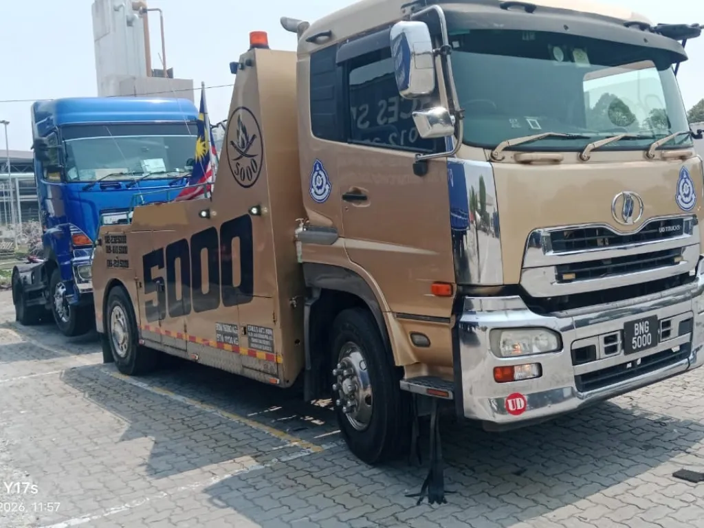 Car carrier transporting a vehicle